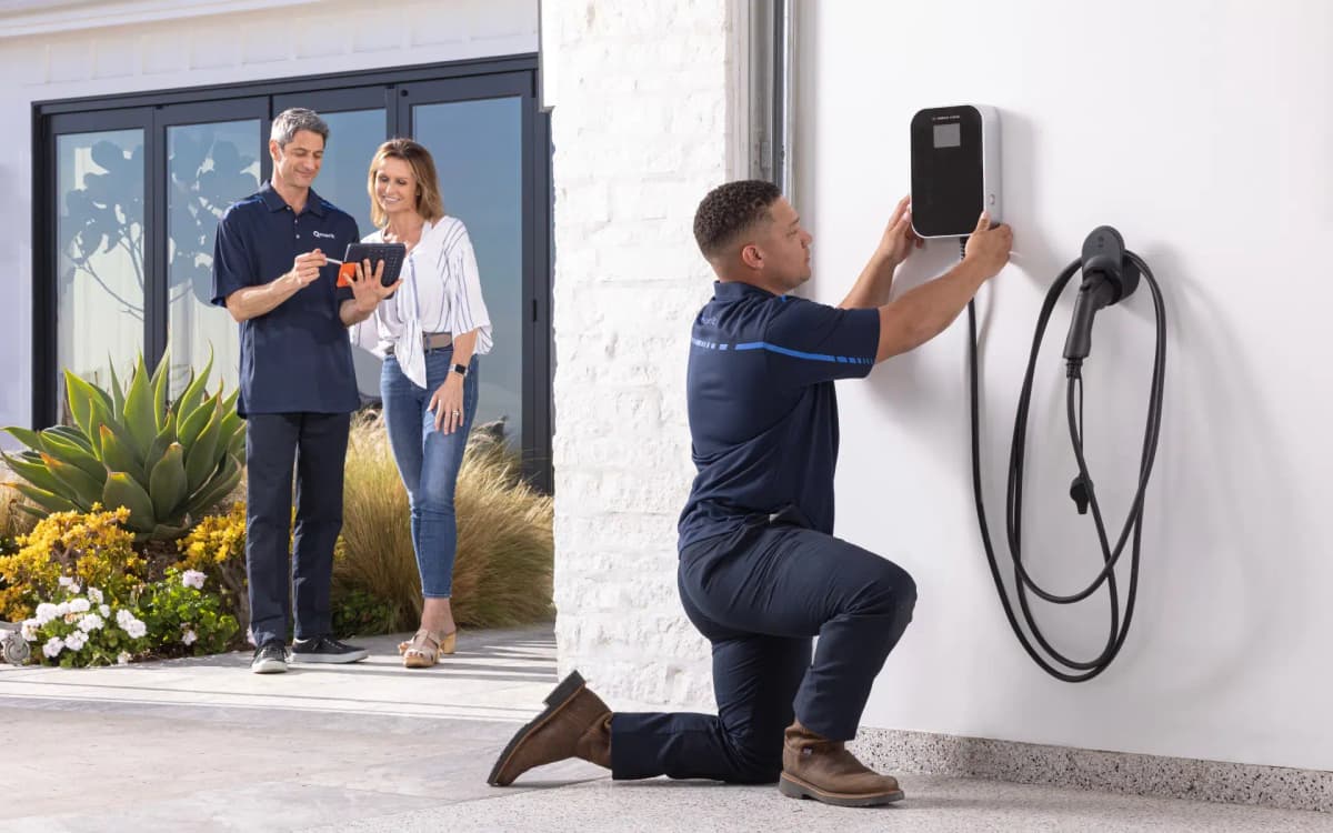 An EV charger ready for use in a modern garage